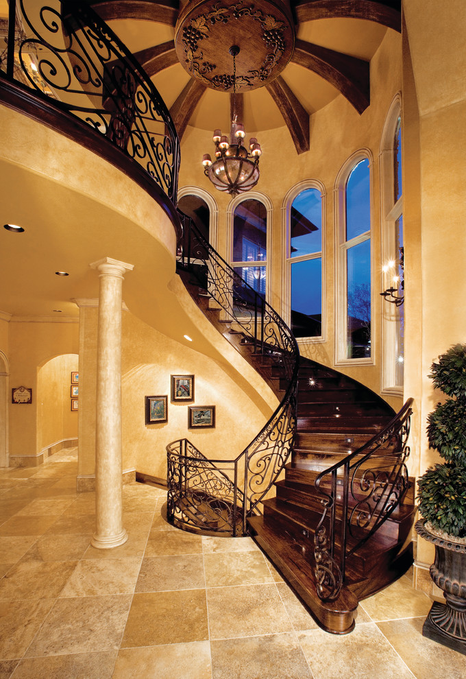 Design ideas for an expansive mediterranean wood curved staircase in Miami with wood risers.