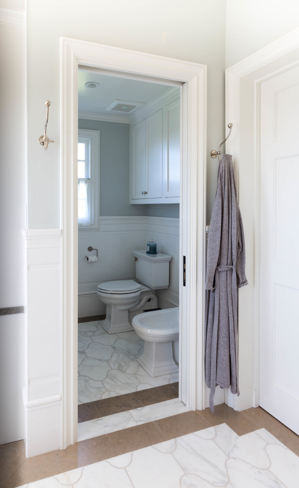 Photo of a large transitional master bathroom in San Diego with open cabinets, distressed cabinets, a freestanding tub, an alcove shower, a two-piece toilet, white tile, marble, green walls, marble floors, an undermount sink and marble benchtops.