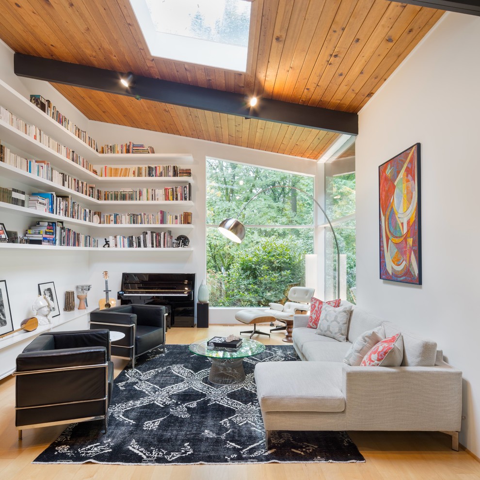 This is an example of a midcentury living room in Portland with a music area.