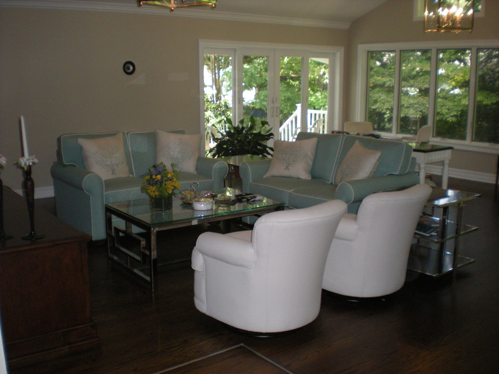 This is an example of a large contemporary sunroom in Raleigh with dark hardwood floors.