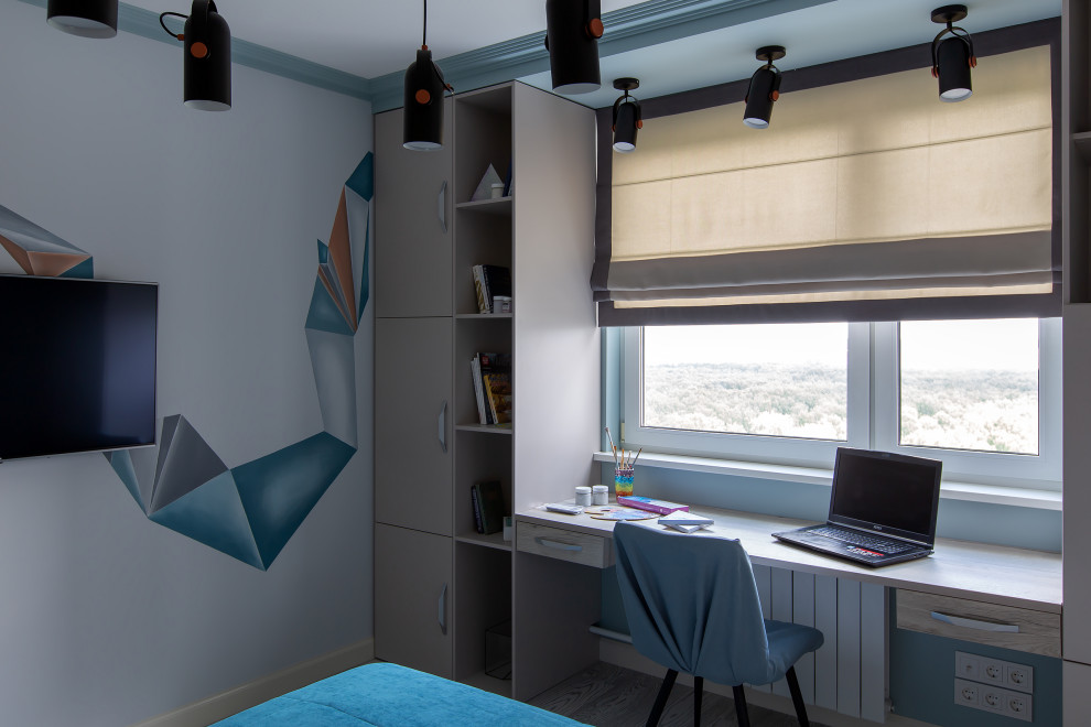 Inspiration för mellanstora moderna barnrum kombinerat med skrivbord, med blå väggar, korkgolv och grått golv