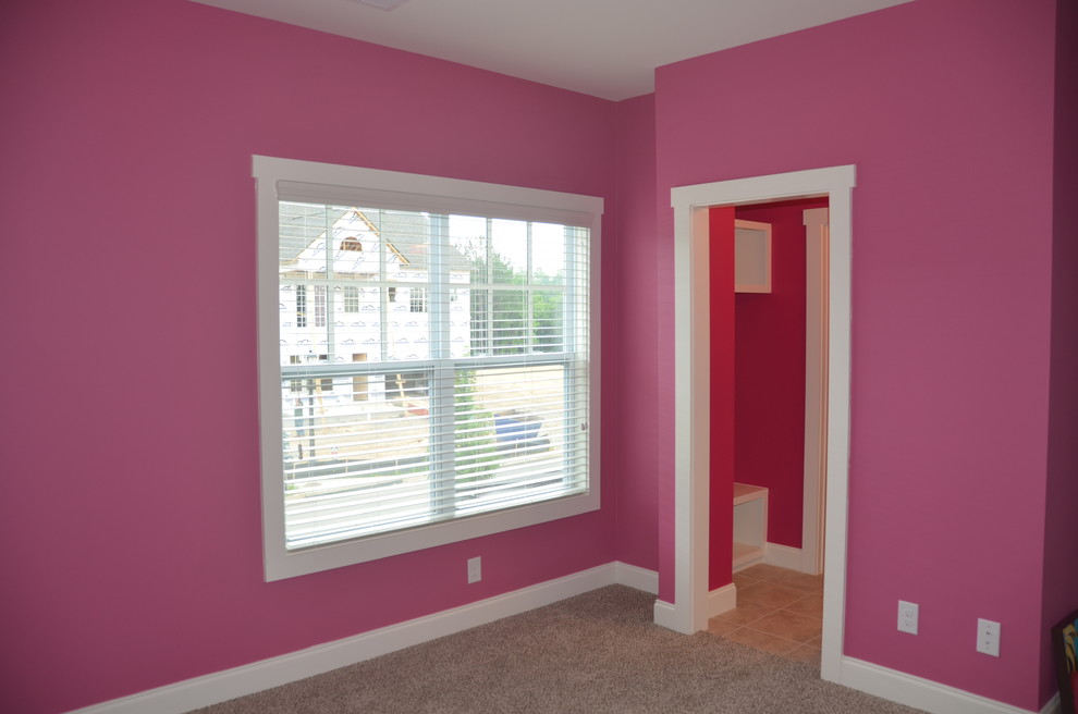 Photo of a mid-sized contemporary guest bedroom in Atlanta with pink walls, carpet, no fireplace and beige floor.