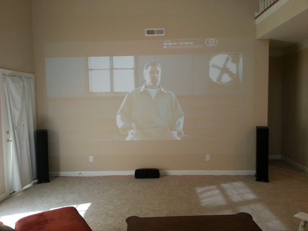 Living room with projector and fireplace