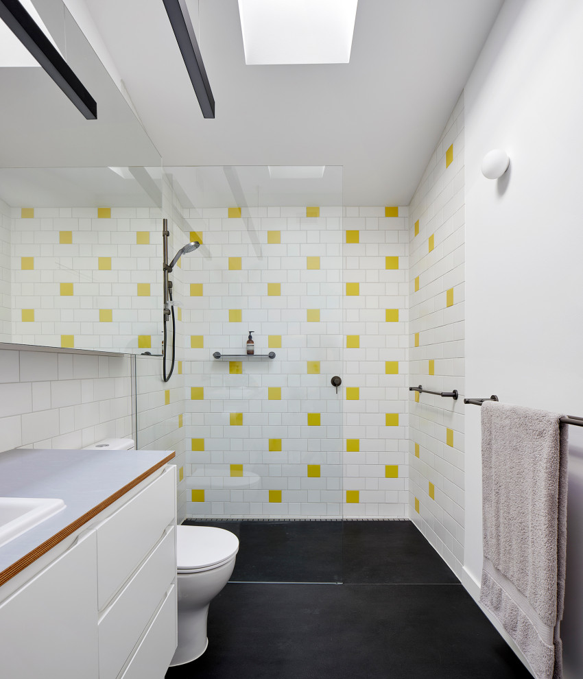 Small scandinavian master bathroom in Melbourne with white cabinets, a curbless shower, a one-piece toilet, white tile, ceramic tile, white walls, porcelain floors, a drop-in sink, wood benchtops, grey floor, an open shower and grey benchtops.
