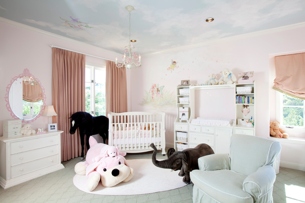Photo of a large traditional nursery for girls in Houston with pink walls, carpet and grey floor.