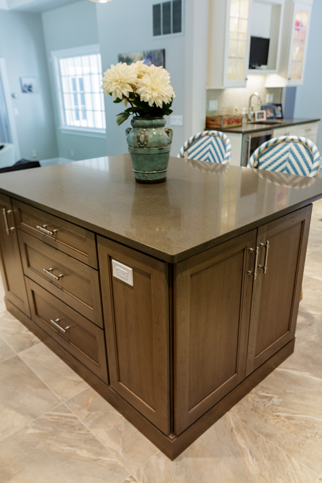 Mid-sized mountain style l-shaped porcelain tile and beige floor open concept kitchen photo in Bridgeport with an undermount sink, shaker cabinets, white cabinets, granite countertops, beige backsplash, porcelain backsplash, stainless steel appliances and an island