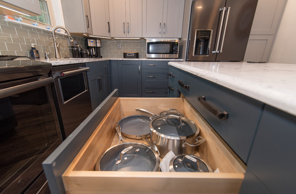 Eat-in kitchen - mid-sized transitional l-shaped brown floor eat-in kitchen idea in Baltimore with a single-bowl sink, shaker cabinets, gray cabinets, quartz countertops, gray backsplash, subway tile backsplash, stainless steel appliances, an island and white countertops
