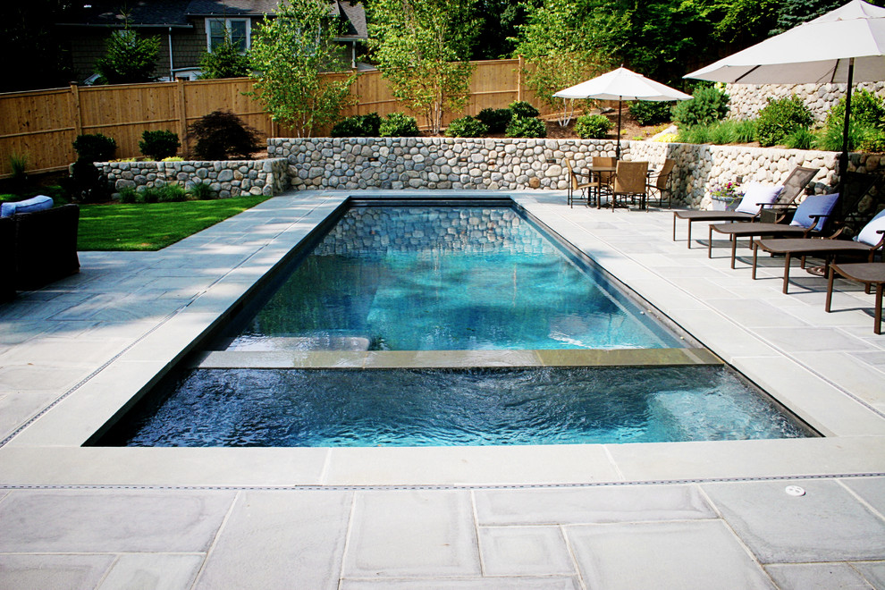 Photo of a small contemporary backyard custom-shaped pool in New York.