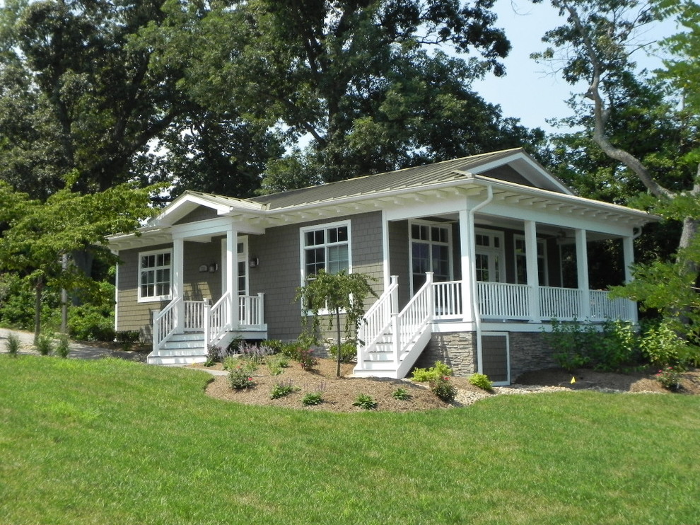 Mid-sized beach style one-storey grey house exterior in Baltimore with wood siding, a hip roof and a metal roof.