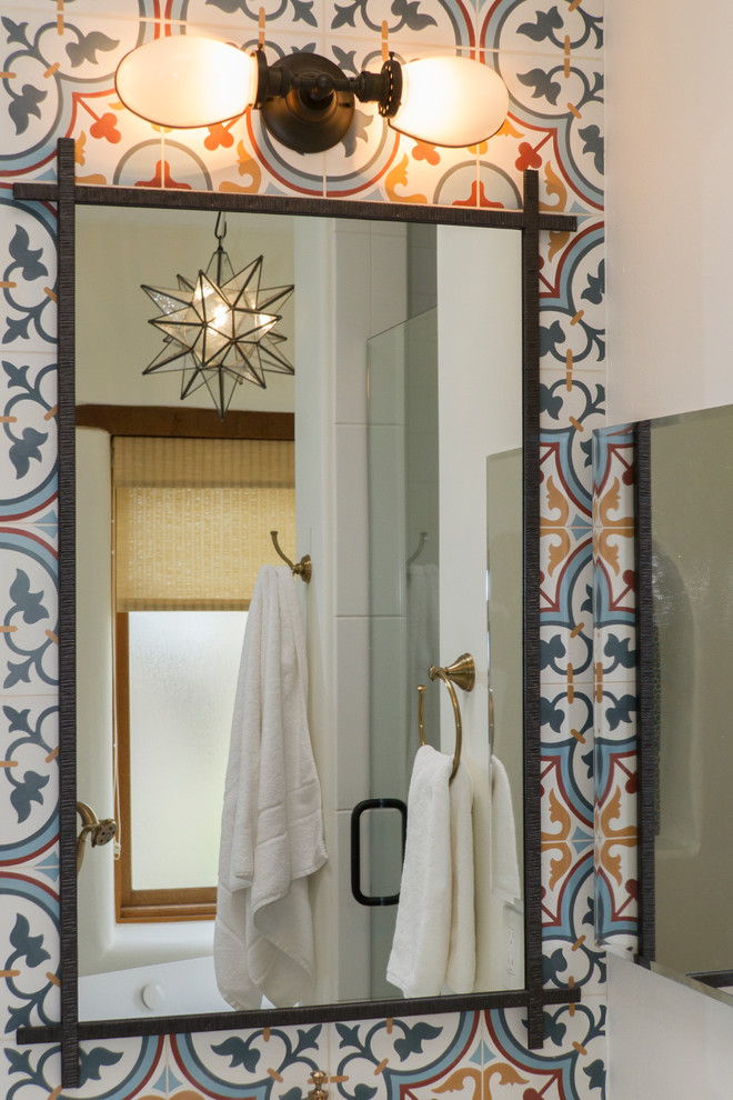 Inspiration for a mid-sized master bathroom in Phoenix with recessed-panel cabinets, medium wood cabinets, a freestanding tub, a curbless shower, a two-piece toilet, white tile, porcelain tile, white walls, cement tiles, an undermount sink, engineered quartz benchtops, multi-coloured floor, a hinged shower door and white benchtops.