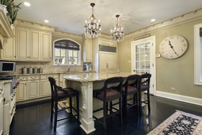Mid-sized traditional l-shaped separate kitchen in Atlanta with an undermount sink, raised-panel cabinets, distressed cabinets, granite benchtops, beige splashback, stone tile splashback, stainless steel appliances, porcelain floors, with island and black floor.