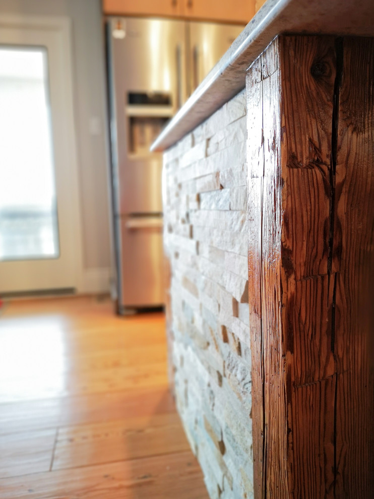 Eat-in kitchen - large transitional u-shaped light wood floor and brown floor eat-in kitchen idea with an undermount sink, flat-panel cabinets, beige cabinets, quartz countertops, white backsplash, subway tile backsplash, stainless steel appliances, an island and white countertops