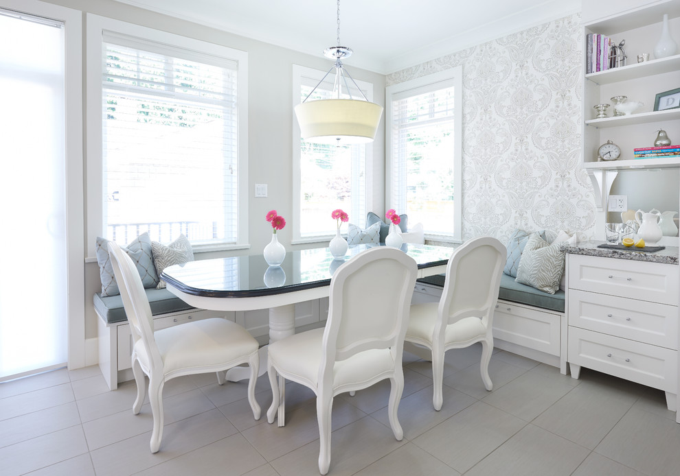 This is an example of a mid-sized transitional dining room in Vancouver with multi-coloured walls and ceramic floors.