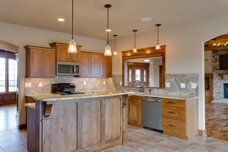 Eat-in kitchen - rustic u-shaped eat-in kitchen idea with shaker cabinets and an island