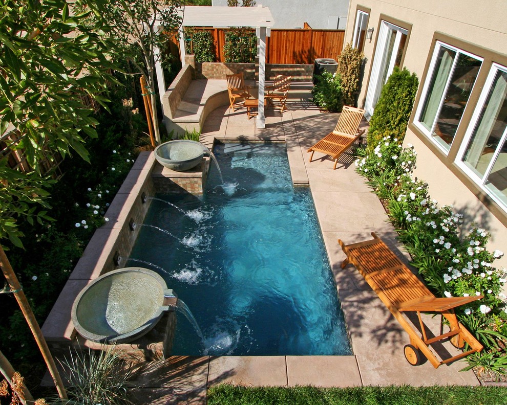 Pool fountain - mid-sized transitional backyard concrete paver and rectangular natural pool fountain idea in Orange County