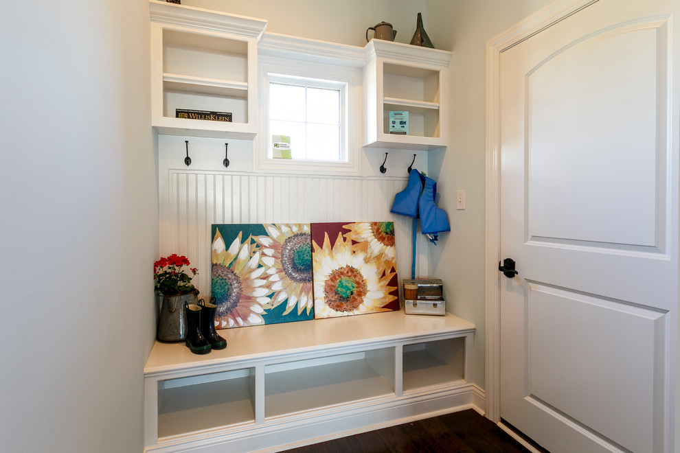 Design ideas for a small traditional mudroom in Louisville with blue walls and dark hardwood floors.