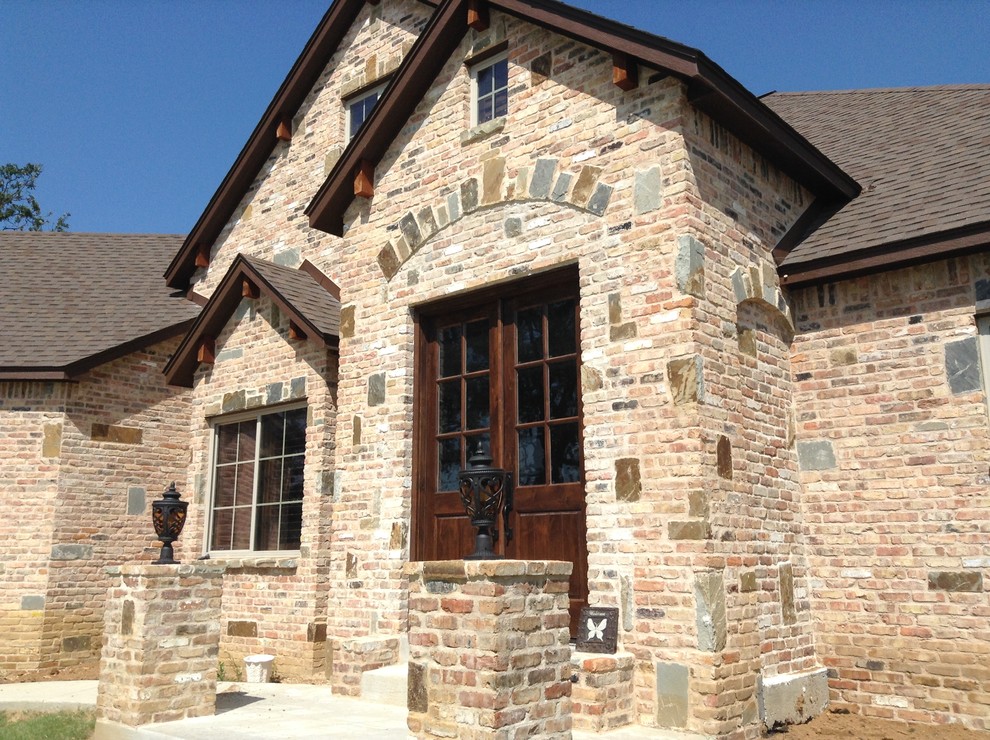 Inspiration for a mid-sized rustic red two-story brick exterior home remodel