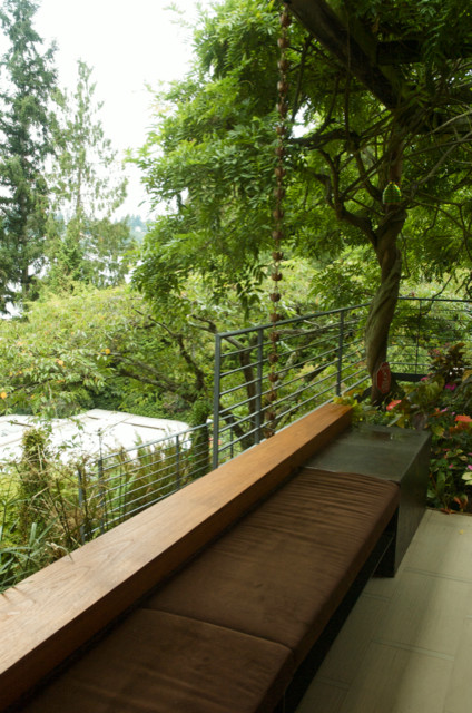 Inspiration for a large contemporary backyard patio in Seattle with a container garden.