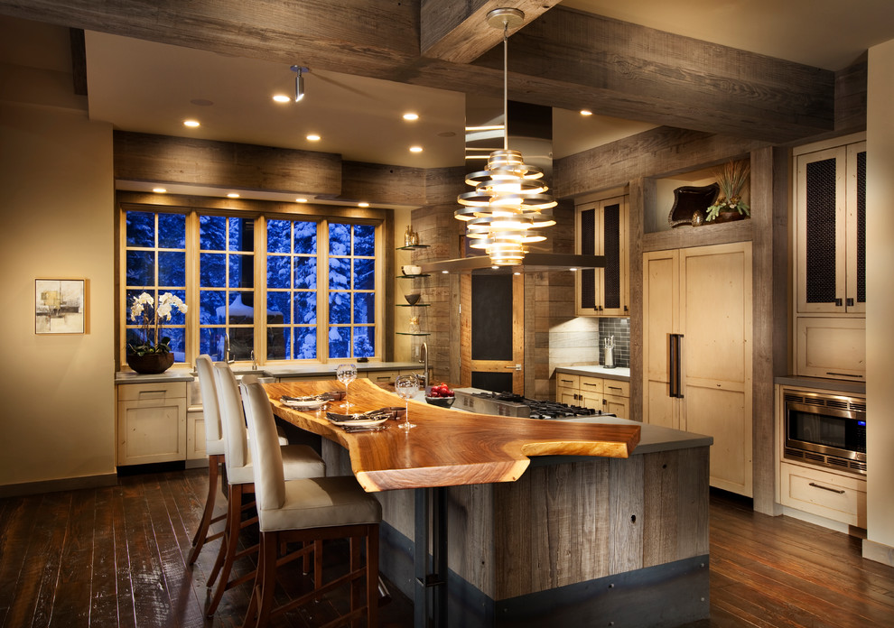 Photo of a country kitchen in San Francisco with wood benchtops, recessed-panel cabinets, panelled appliances and light wood cabinets.