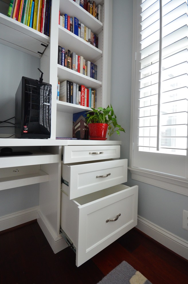Inspiration for a large transitional built-in desk medium tone wood floor and brown floor home design remodel in DC Metro with blue walls and no fireplace