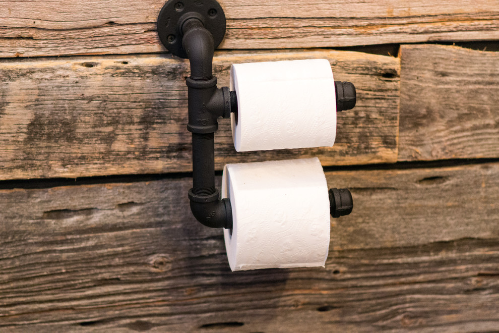 Inspiration for a rustic bathroom remodel in Toronto with wood countertops