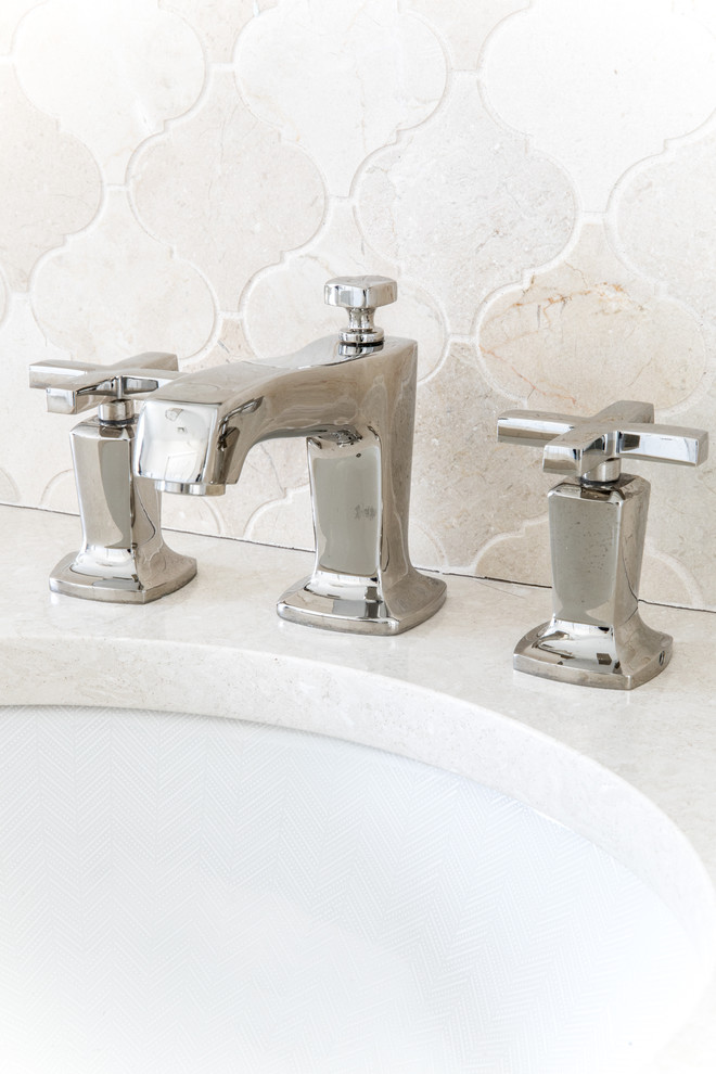 Transitional master beige tile and mosaic tile marble floor and gray floor home design photo in Boston with recessed-panel cabinets, white cabinets, a one-piece toilet, white walls, an undermount sink, quartz countertops, a hinged shower door and beige countertops