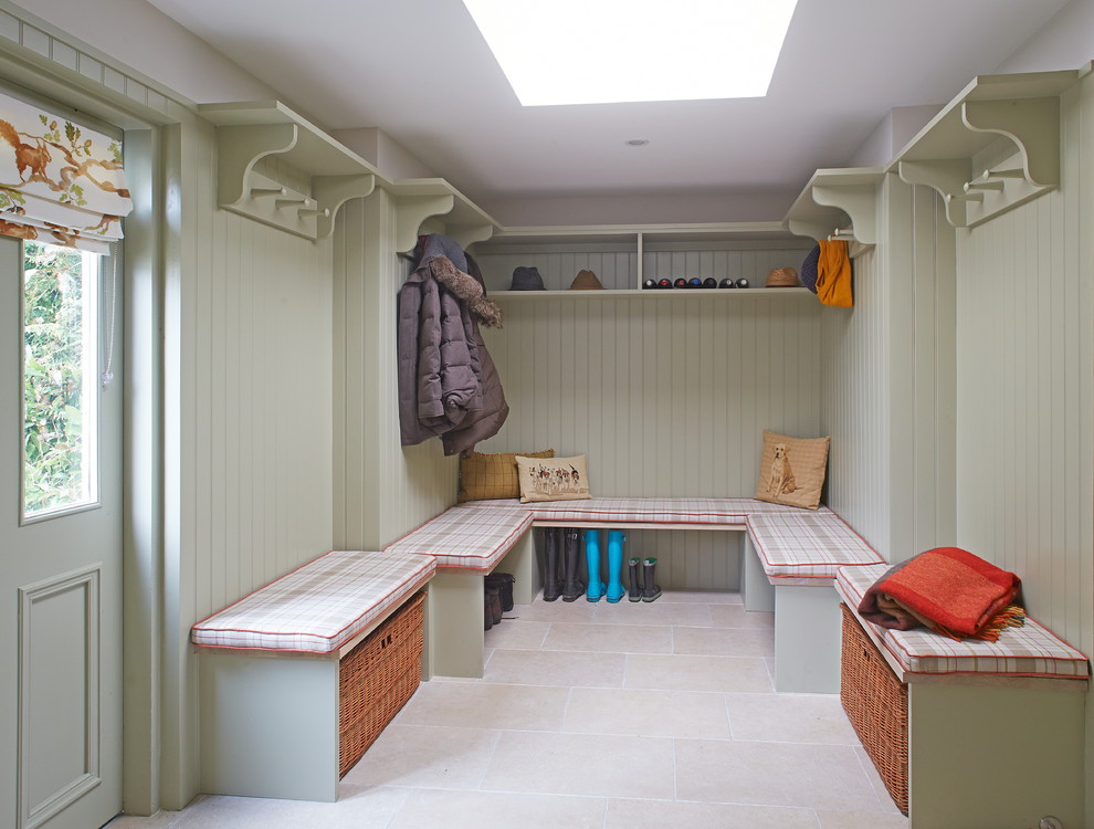 This is an example of a mid-sized country mudroom in Dublin with porcelain floors.