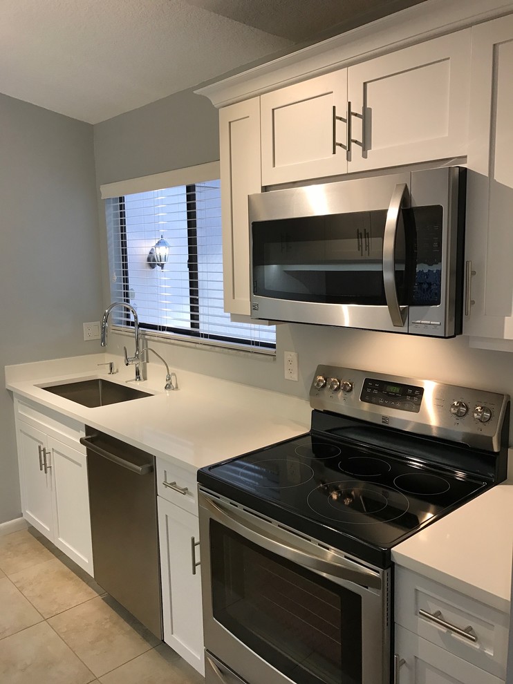 Inspiration for a transitional galley eat-in kitchen remodel in Miami