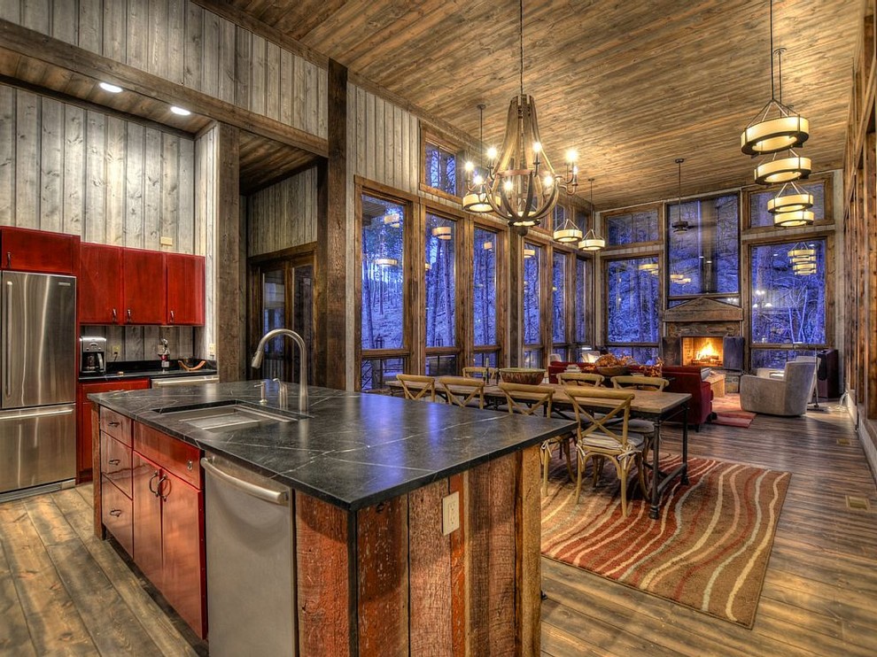 Inspiration for a huge rustic medium tone wood floor open concept kitchen remodel in Minneapolis with an undermount sink, red cabinets, gray backsplash, stainless steel appliances and an island