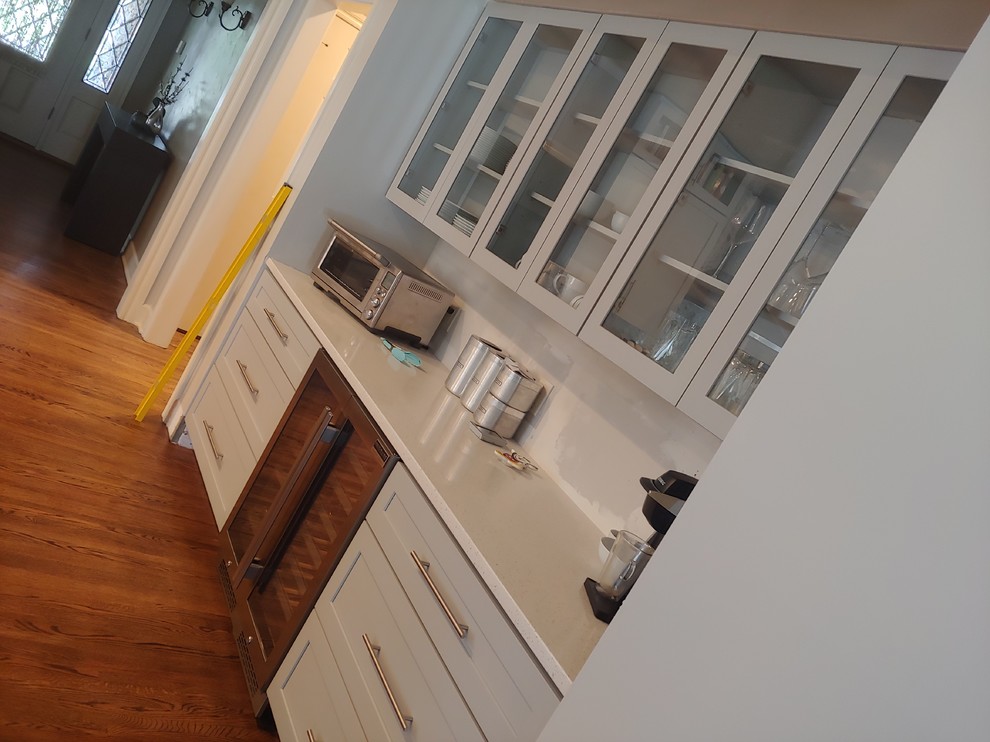 Large transitional single-wall light wood floor eat-in kitchen photo with a single-bowl sink, shaker cabinets, gray cabinets, quartzite countertops, multicolored backsplash, mosaic tile backsplash, stainless steel appliances, an island and white countertops
