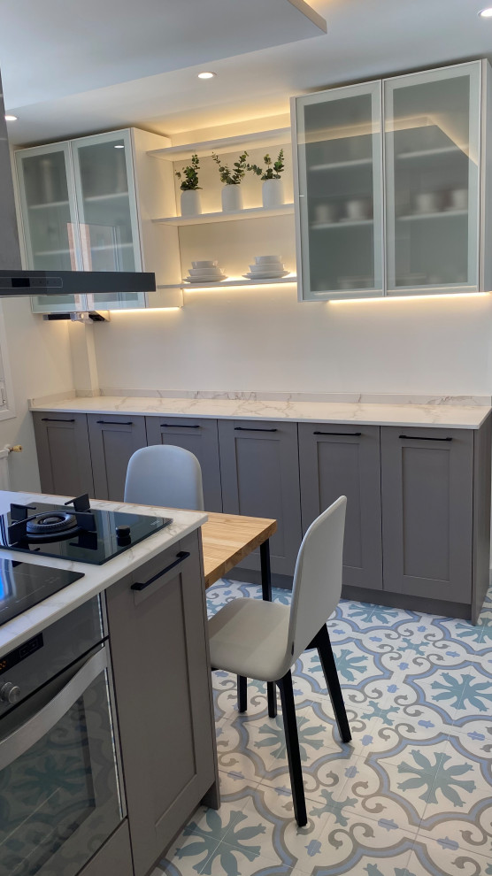 Photo of a large transitional u-shaped separate kitchen in Other with an undermount sink, beaded inset cabinets, pink cabinets, marble benchtops, white splashback, marble splashback, coloured appliances, porcelain floors, multiple islands, multi-coloured floor and white benchtop.