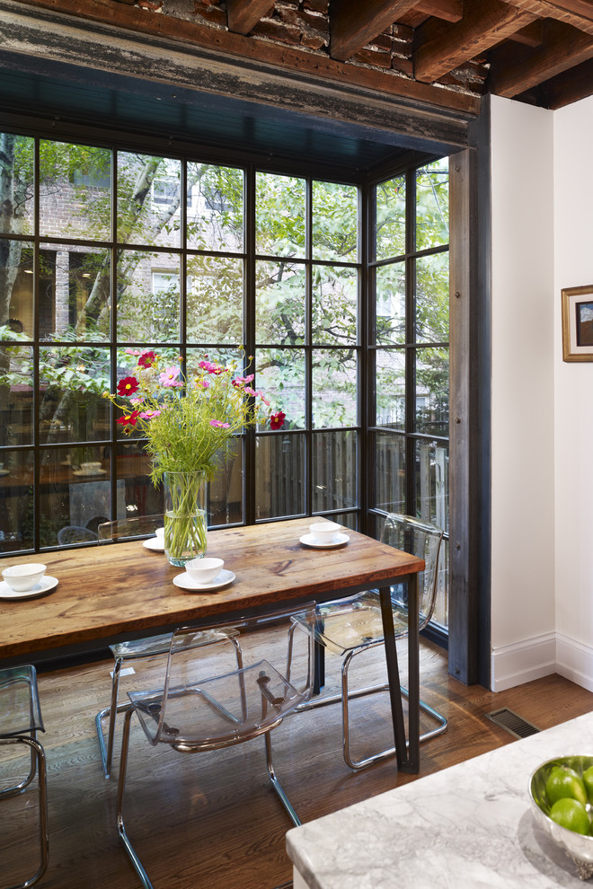 This is an example of a contemporary eat-in kitchen in Philadelphia with marble benchtops.