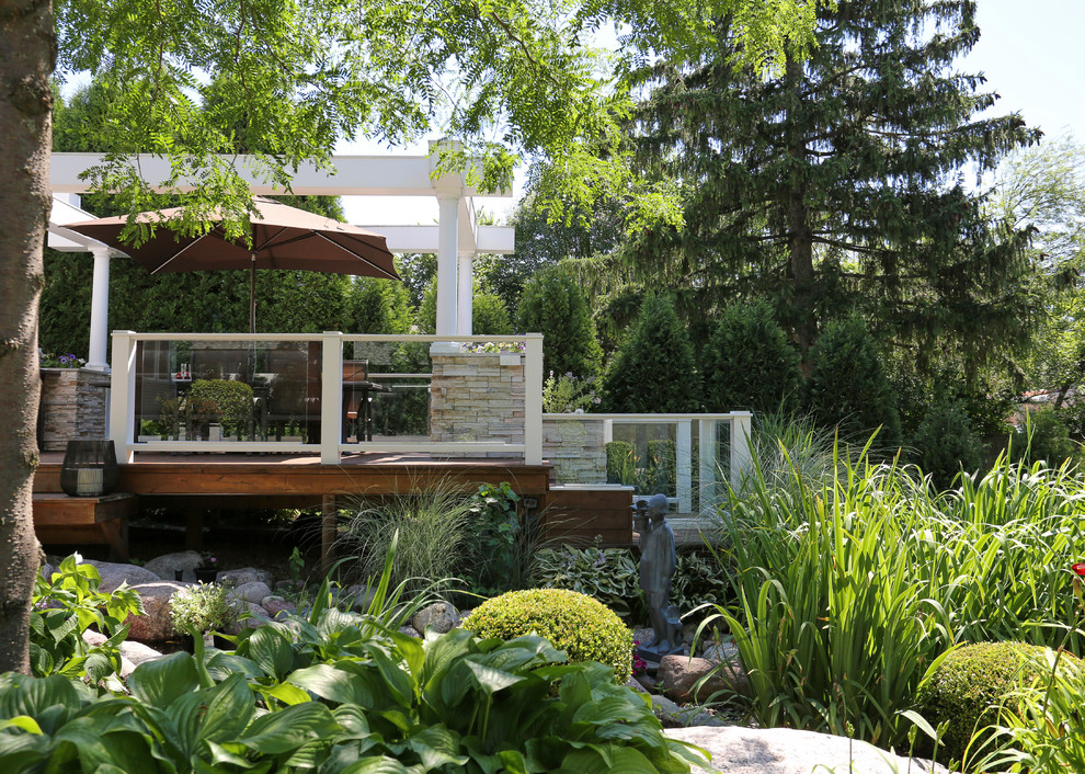Outdoor kitchen deck - huge transitional backyard outdoor kitchen deck idea in Chicago with a pergola