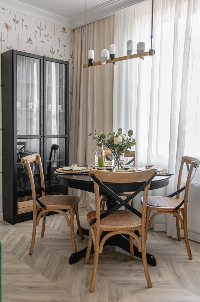 This is an example of a small scandinavian open plan dining in Other with laminate floors.