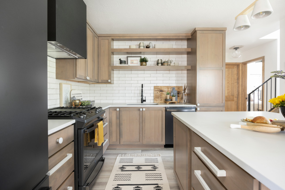 Inspiration for a small scandinavian l-shaped kitchen in Other with a single-bowl sink, shaker cabinets, beige cabinets, quartz benchtops, white splashback, stone tile splashback, black appliances, laminate floors, with island, beige floor and white benchtop.