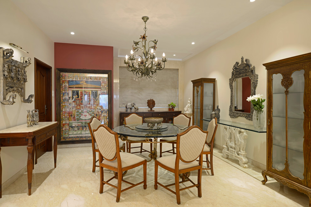 Photo of a mid-sized asian separate dining room in Mumbai with beige floor and beige walls.