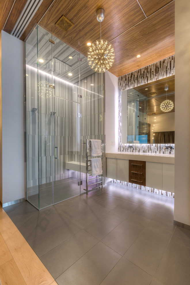 Photo of an expansive modern master bathroom in Kansas City with an integrated sink, flat-panel cabinets, white cabinets, quartzite benchtops, a curbless shower, multi-coloured tile, mosaic tile, white walls and ceramic floors.