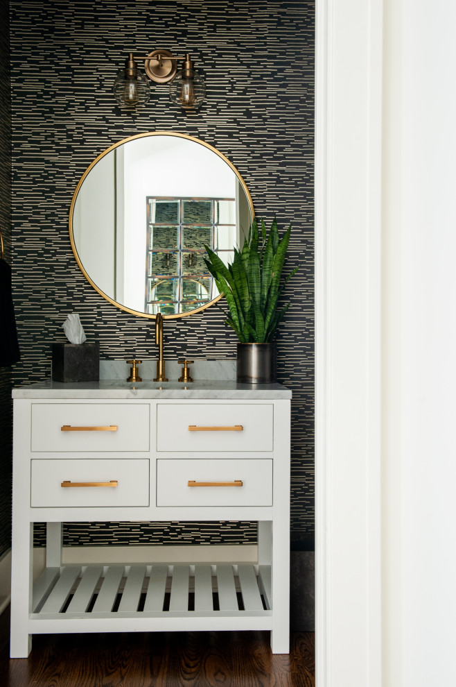 Country powder room in Nashville with flat-panel cabinets, white cabinets, black walls, dark hardwood floors, an undermount sink, brown floor, grey benchtops, a freestanding vanity and wallpaper.