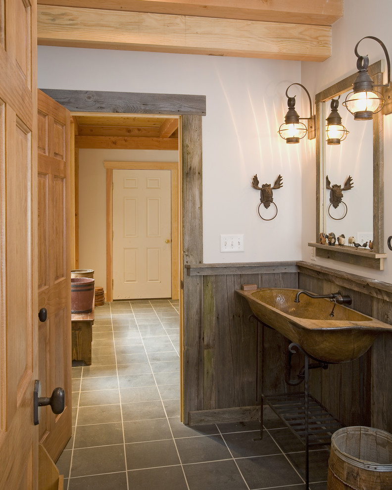 Inspiration for a country bathroom in Burlington with a trough sink and open cabinets.