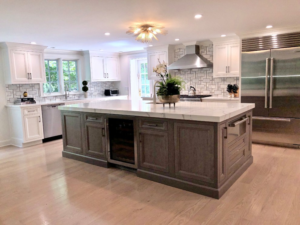 Eat-in kitchen - large transitional eat-in kitchen idea in New York with beaded inset cabinets, gray cabinets, quartz countertops and an island