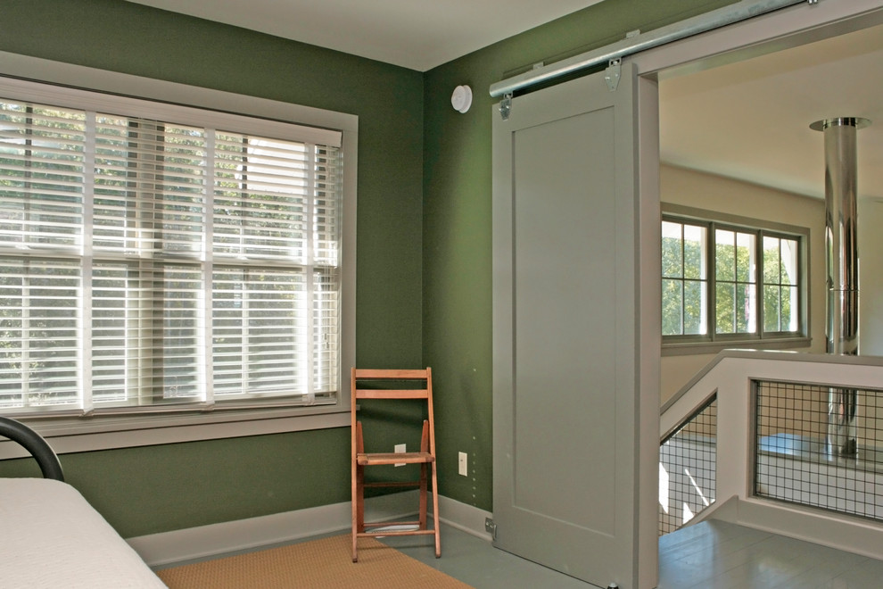 Photo of a contemporary home office in Grand Rapids with painted wood floors.