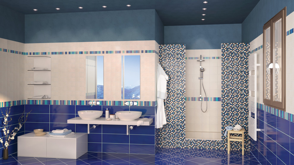 Imagen de cuarto de baño actual con baldosas y/o azulejos azules, baldosas y/o azulejos de cerámica, paredes azules, suelo de baldosas de cerámica, encimera de azulejos, suelo azul y encimeras azules