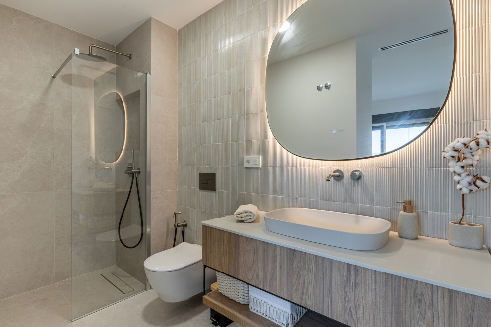 Photo of a mid-sized scandinavian powder room in Alicante-Costa Blanca with open cabinets, medium wood cabinets, a one-piece toilet, gray tile, ceramic tile, ceramic floors, marble benchtops, grey floor, beige benchtops and a floating vanity.