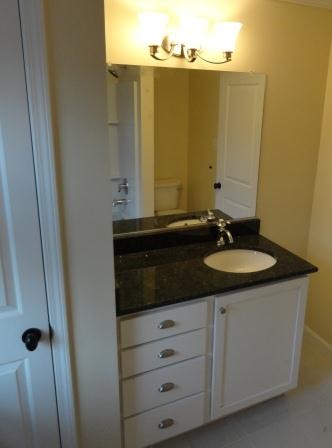 Arts and crafts 3/4 bathroom photo in Richmond with flat-panel cabinets and turquoise cabinets