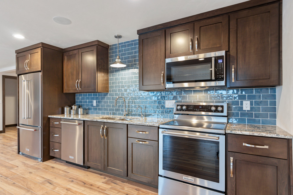 Example of a large transitional walk-out ceramic tile and brown floor kitchen design with white walls and no fireplace