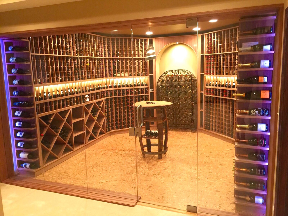 Inspiration for a mid-sized contemporary wine cellar in St Louis with cork floors and storage racks.
