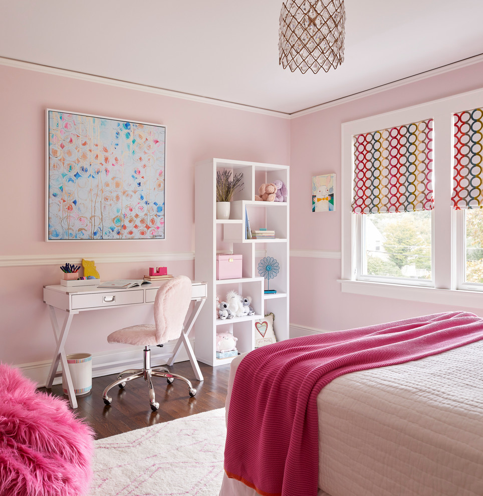 Transitional kids' room in Boston with pink walls, dark hardwood floors and brown floor for girls.