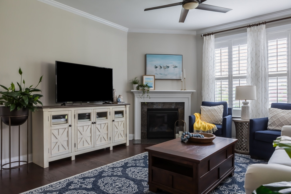 Inspiration for a mid-sized contemporary dark wood floor and brown floor living room remodel in Raleigh with gray walls, a corner fireplace, a wood fireplace surround and a tv stand