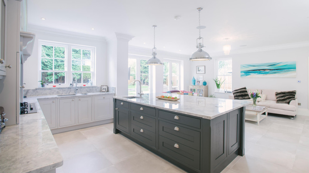 Inspiration for a large grey and black u-shaped open plan kitchen in Sussex with shaker cabinets, grey cabinets, quartz worktops, grey splashback, porcelain flooring, an island, grey floors, grey worktops, feature lighting, a single-bowl sink, stone slab splashback and integrated appliances.