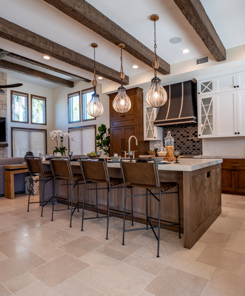 Design ideas for a large country l-shaped kitchen in Orange County with a farmhouse sink, recessed-panel cabinets, medium wood cabinets, quartzite benchtops, white splashback, mosaic tile splashback, panelled appliances, limestone floors, with island, beige floor and beige benchtop.